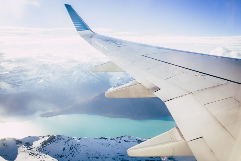 Plane window view of mountains